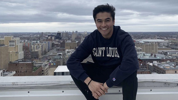 Student Sa'ad Khan smiling on a rooftop.